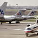 American Airlines jets sit on the tarmac as an American Eagle jet taxis to the gate at O’Hare International Airport April 25, 2003 in Chicago.
